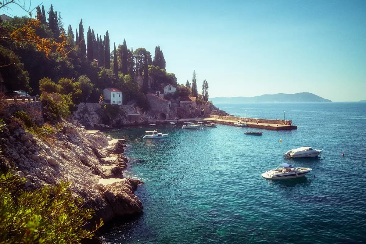 Adriatic coast with sunny harbor in Trsteno, Dalmatia, Croatia. Tourist attraction near Dubrovnik.