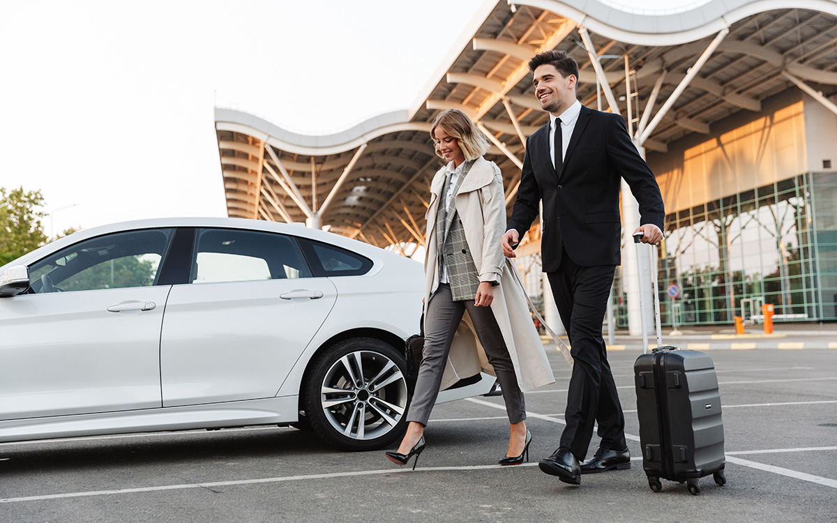 couple book a vehicle hire at the airport