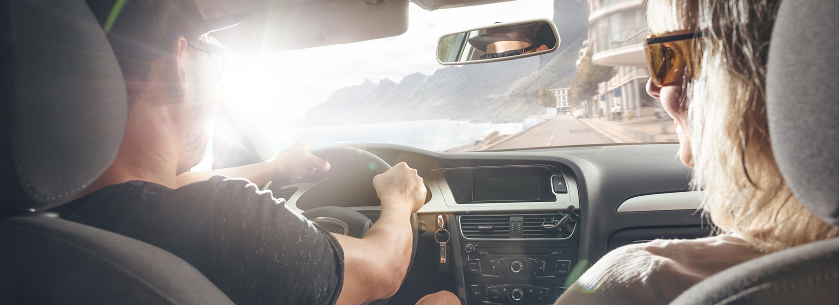 Scenic coastal drive from inside a rental car
