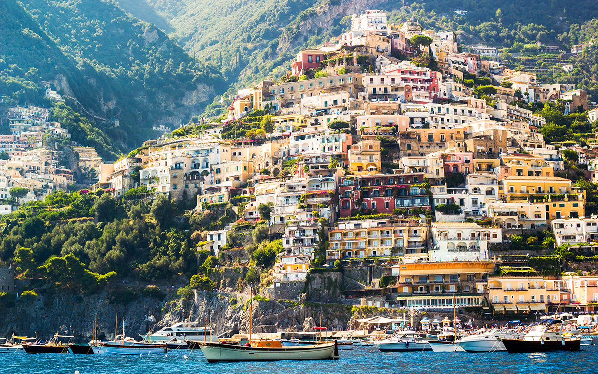 Positano, Amalfi Coast, Italy. Colorfull buildings near the sea with boats