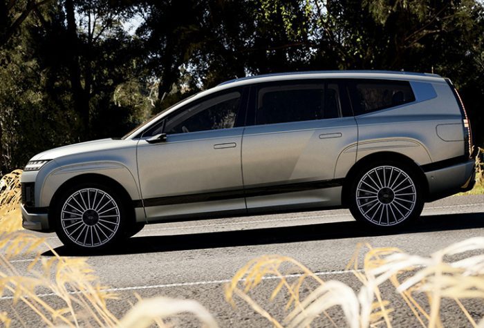 premium 6 seater car hire vehicle driving through nature with large wheels and modern styling