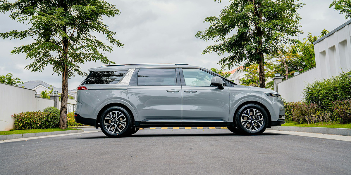 side view of modern 6 seater family car parked on a quiet residential street