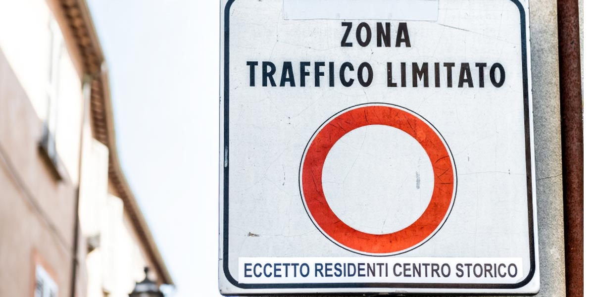 Zona Traffico Limitato road sign with a red circle and an exception for historic center residents
